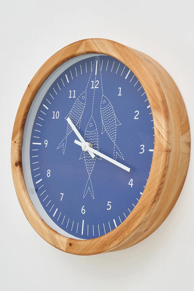 Horloge murale avec motif de poissons
